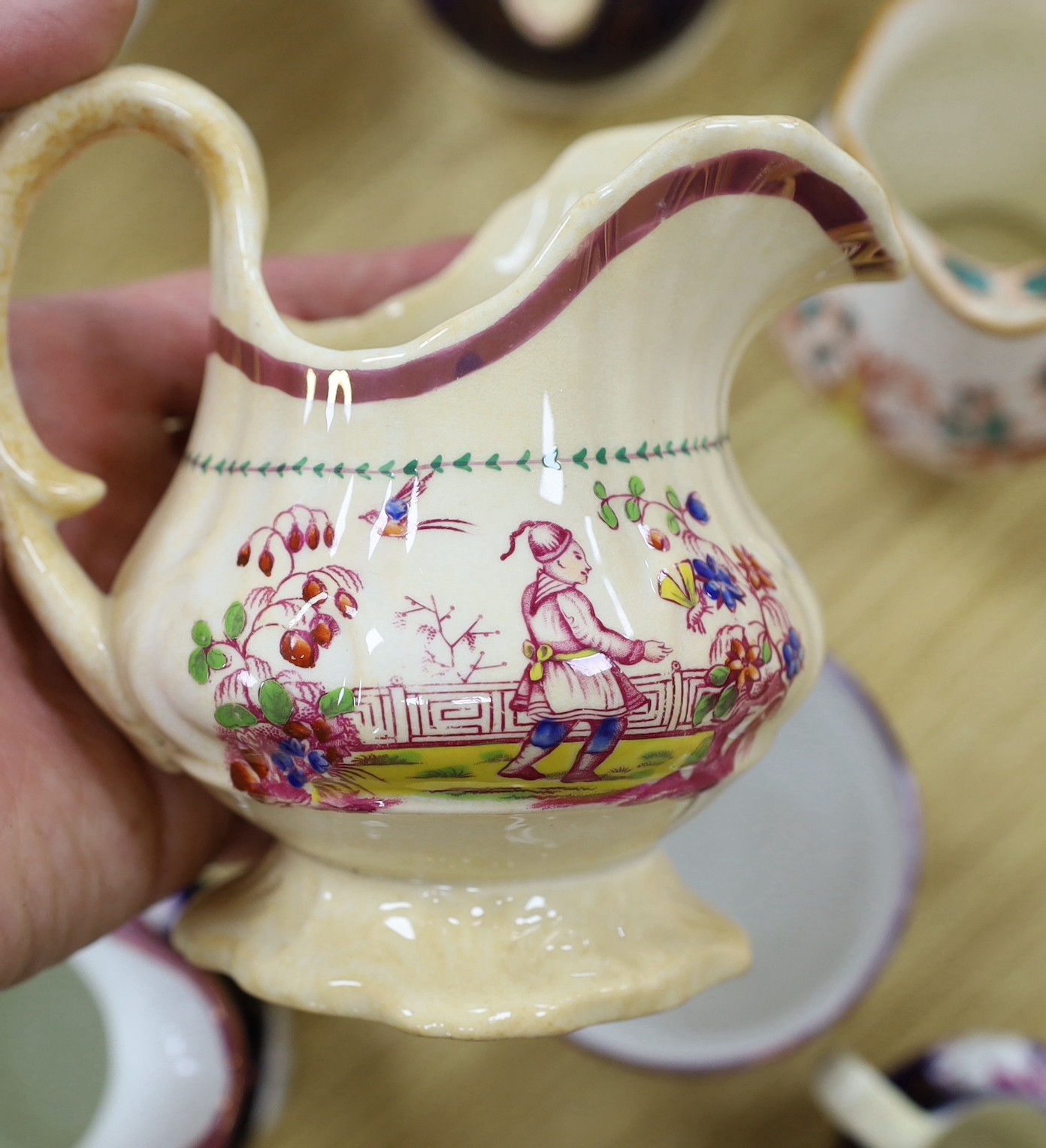 A quantity of Gaudy Welsh lustre jugs and mugs with chinoiserie motifs